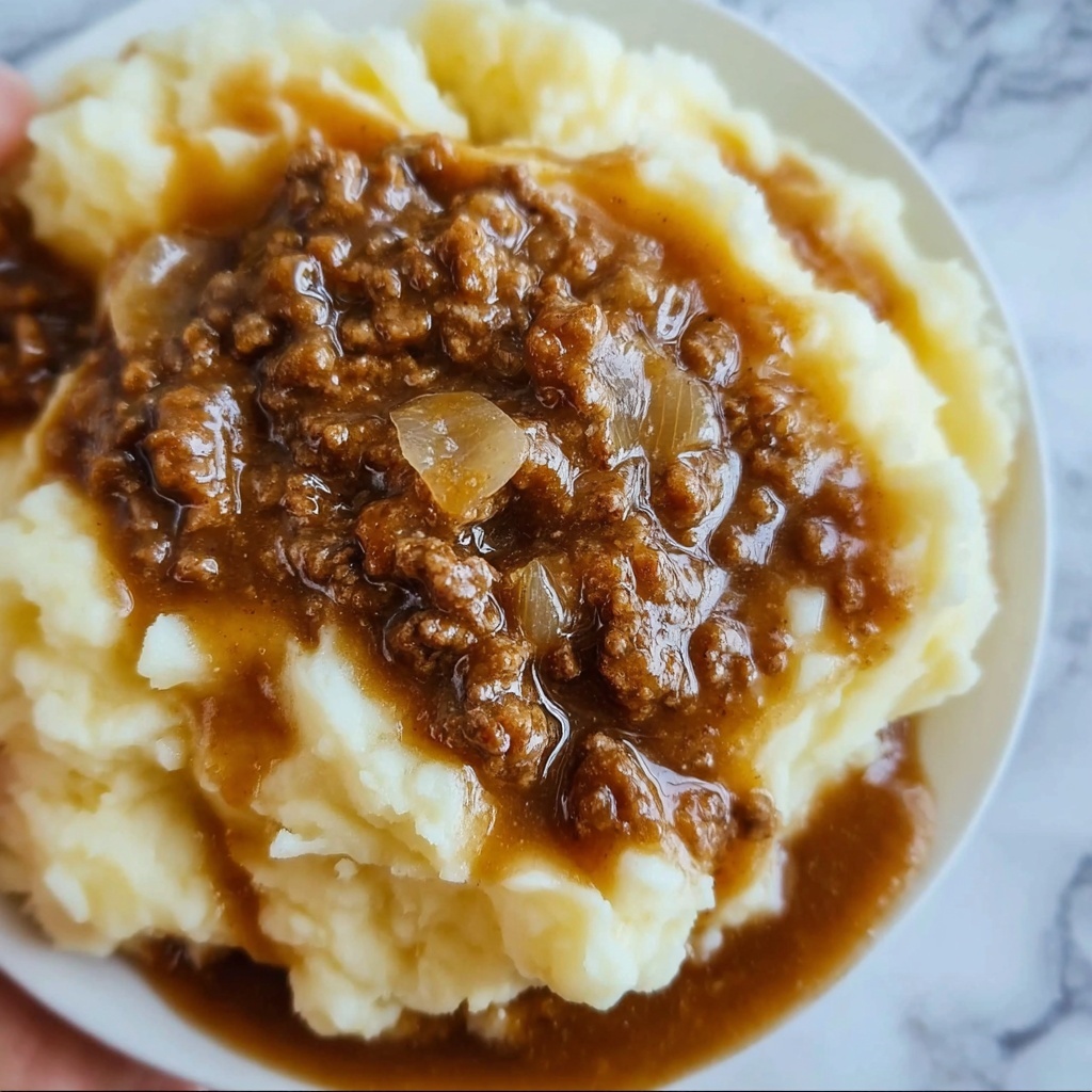 Ground Beef and Gravy Over Mashed Potatoes: Comfort Food Bliss Recipe - Recipe Image