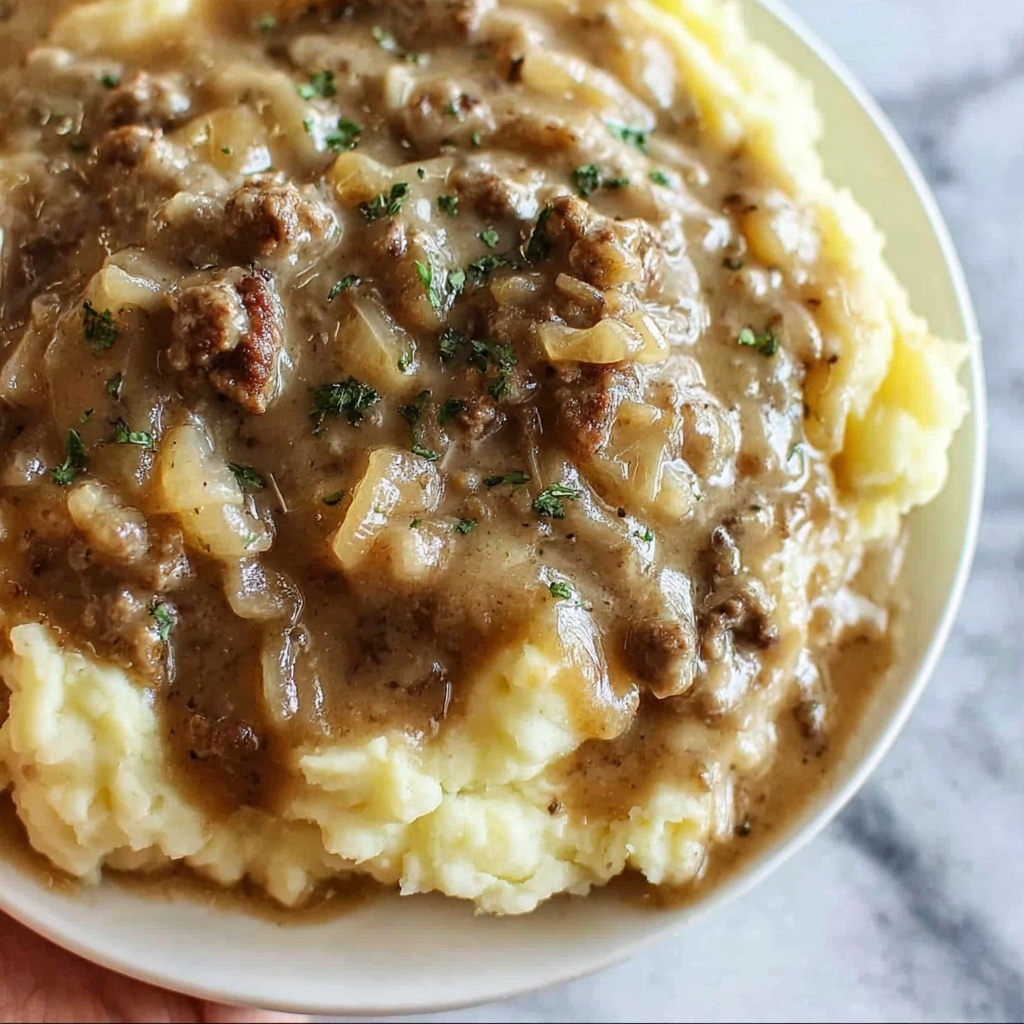 Ground Beef and Gravy Over Mashed Potatoes: Comfort Food Bliss Recipe - Recipe Image